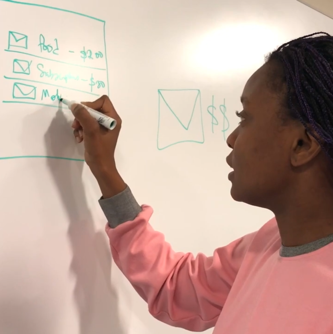 Adesuwa sketching plans for budgetting app