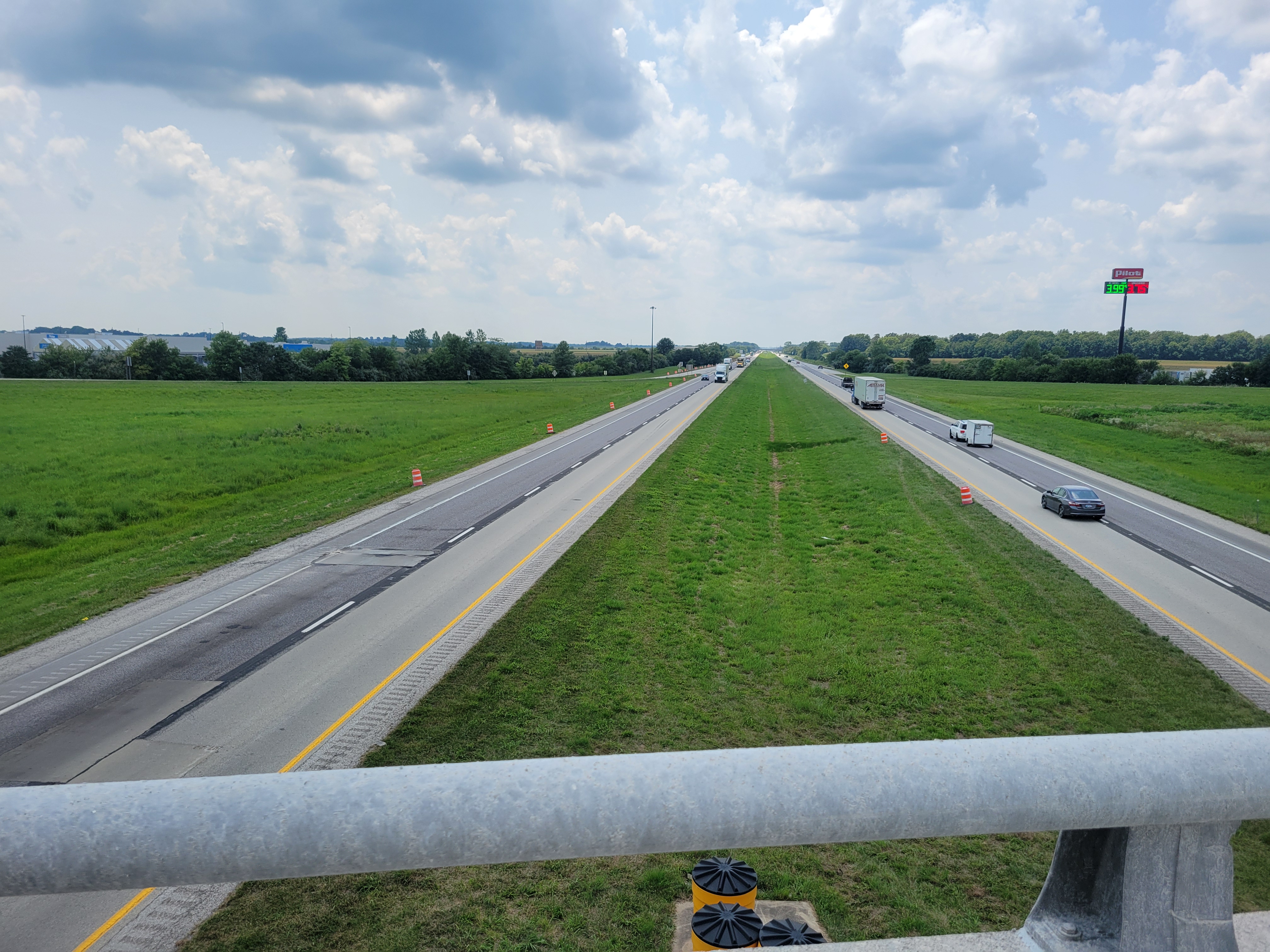 A divided highway separated by several feet of grass