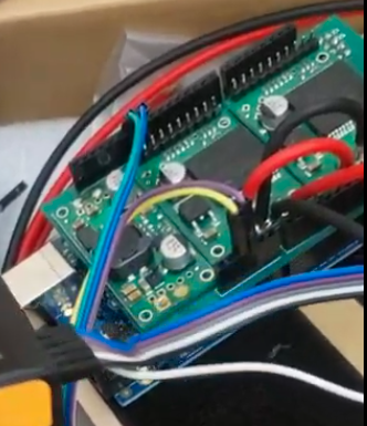 Arduino Uno Circuit board with components plugged in, assembled by Adesuwa